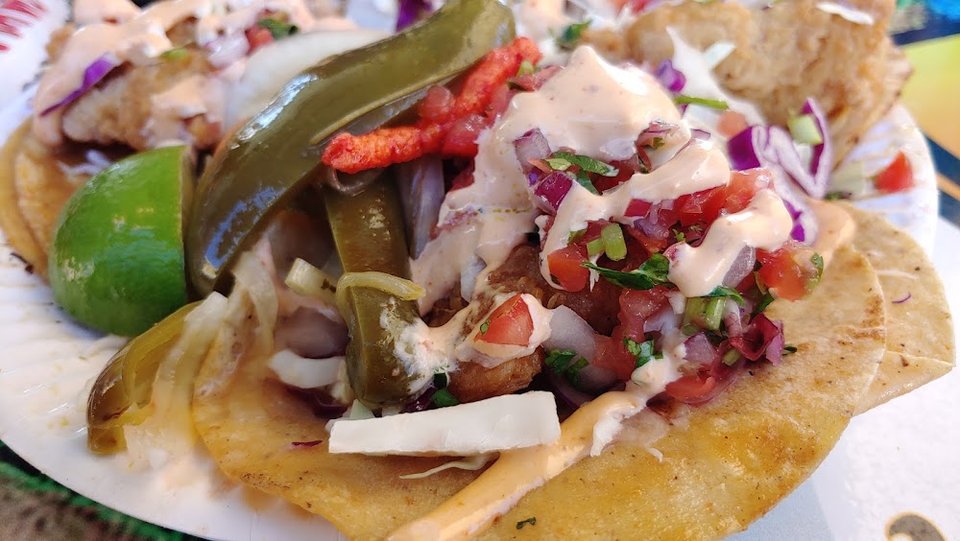 Restaurant menu showing birria, nachos, and burritos.