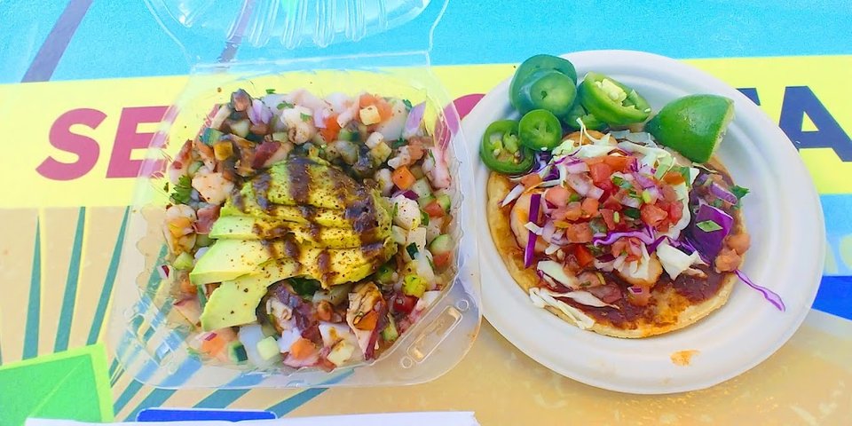 Printed menu with aguachiles, burritos, and tacos.