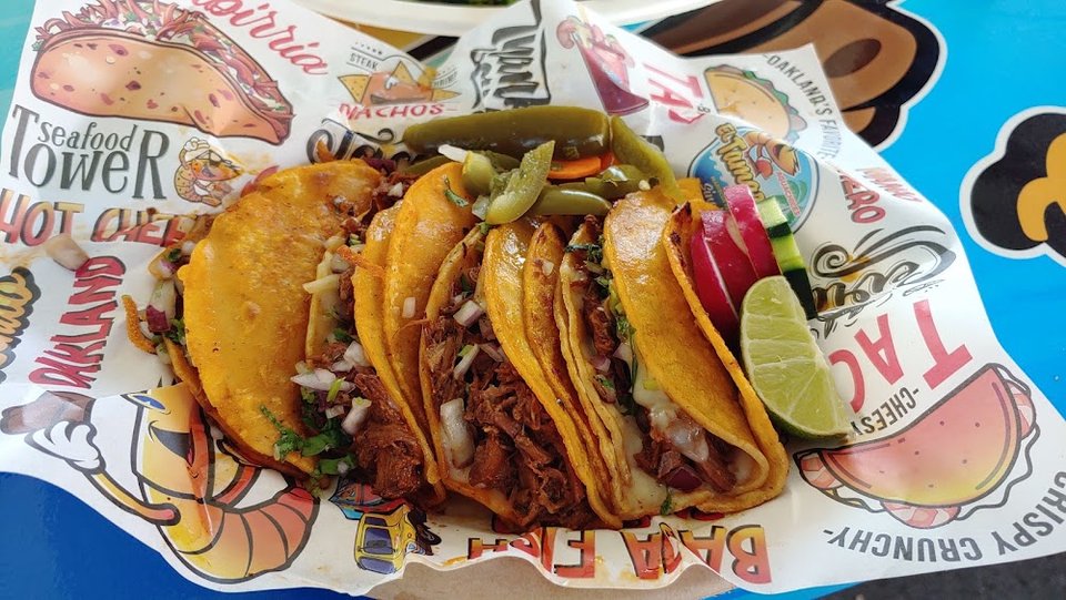 Printed menu with aguachiles, burritos, and tacos.