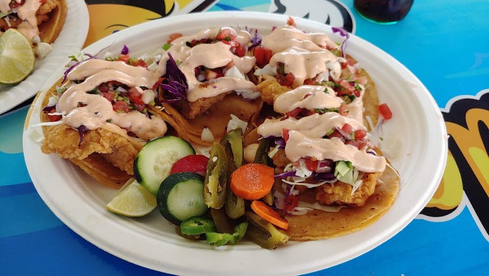 Restaurant menu showing birria, nachos, and burritos.